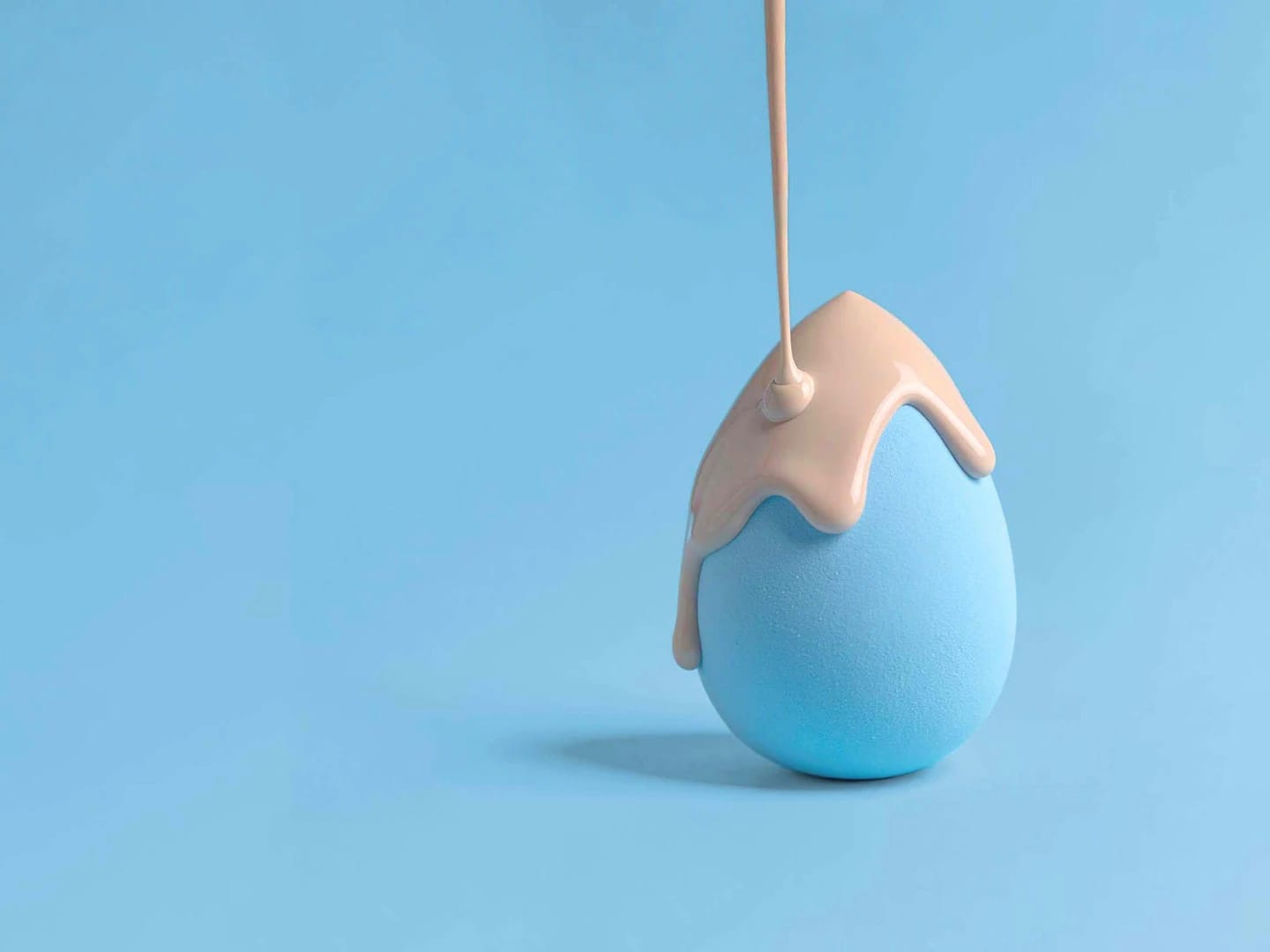 liquid foundation dripping on a makeup sponge developed for Amway