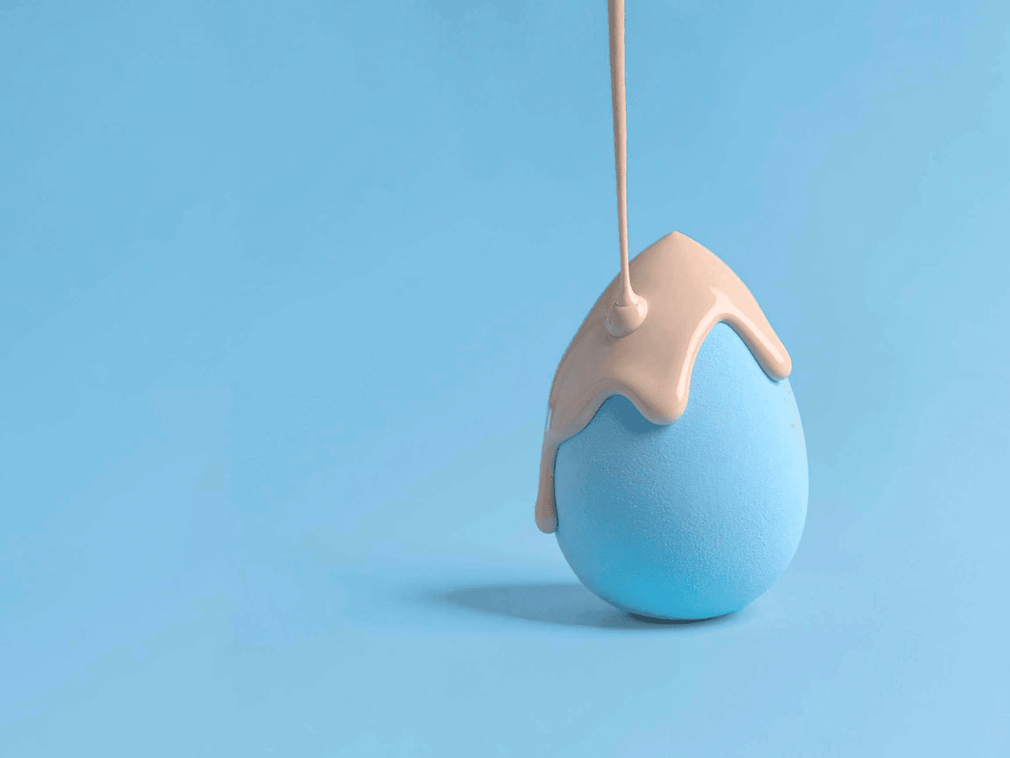 liquid foundation dripping on a makeup sponge developed for Amway